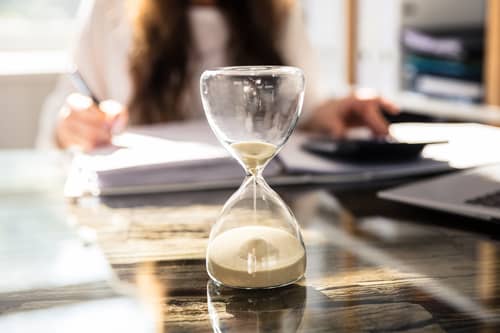 hourglass on desk